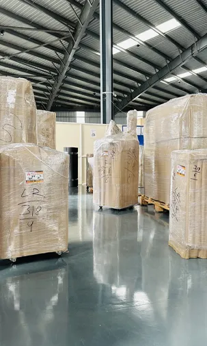 Secure warehouse with Amarsons Prime Storage boxes and staff organizing inventory