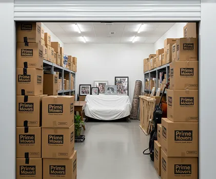 Household storage unit with well-arranged boxes, furniture, and personal items, packed for safety