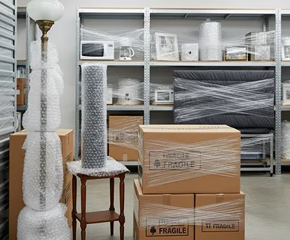 Well-organized luggage storage unit with travel bags and suitcases neatly arranged